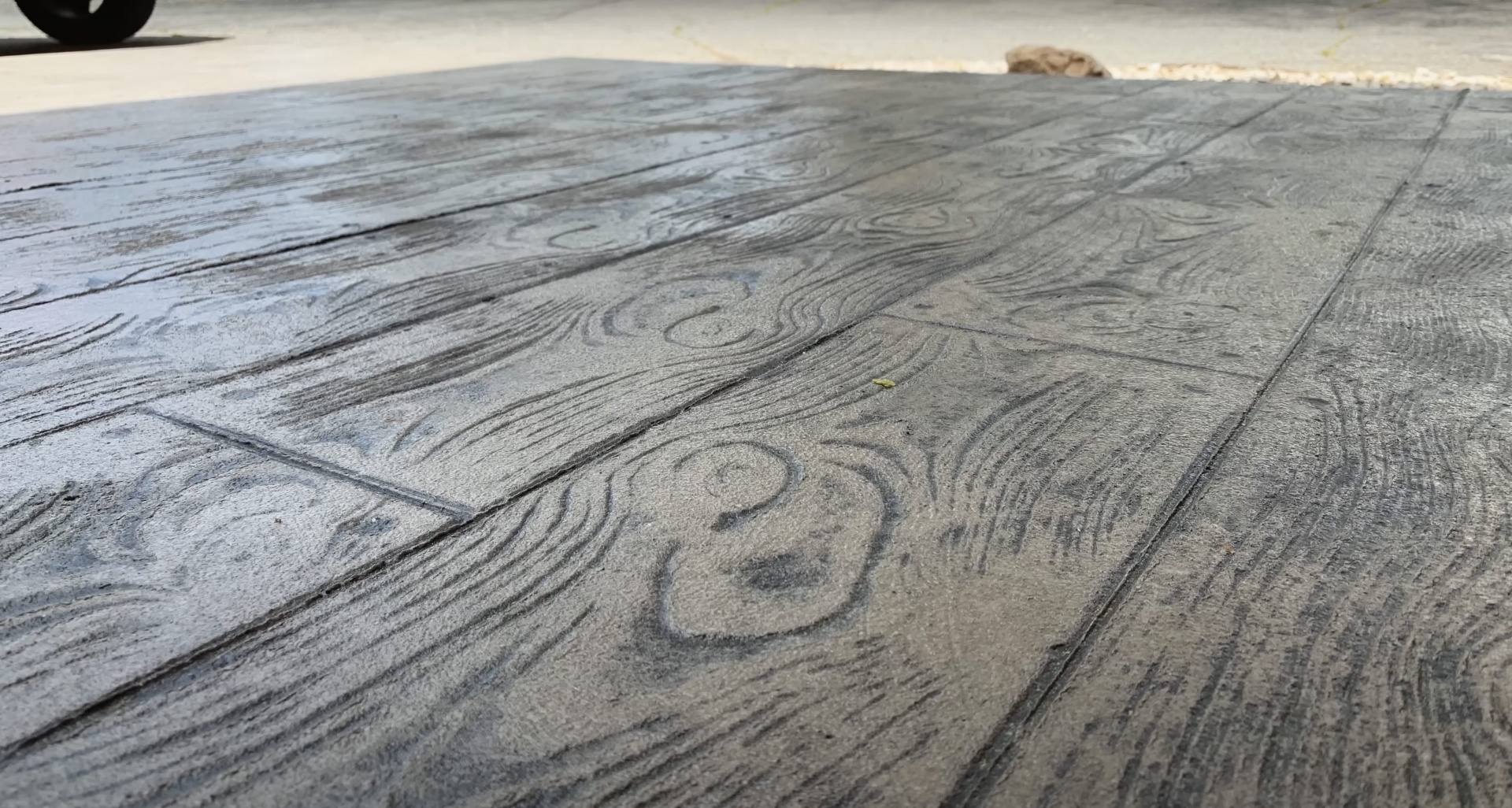 Beautiful wood-grain stamped concrete surface showing decorative concrete expertise Beautiful wood-grain stamped concrete surface showing decorative concrete expertise